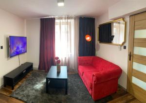 TV a/nebo společenská místnost v ubytování FiftyShades Apartmán s vířivkou