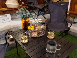 a table with a tray of food and drinks on it at Shim San Jae in Seoul