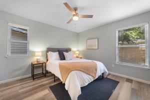 a bedroom with a bed and a ceiling fan at NEW Modern Bungalow Close to Downtown! Fully Fenced Yard in Saint Augustine