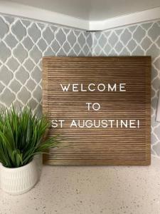 a sign that says welcome to st austin at NEW Modern Bungalow Close to Downtown! Fully Fenced Yard in Saint Augustine