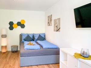 Cama o camas de una habitación en Gemütliches Apartment mit Terrasse in ruhiger Lage