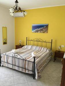 Ένα ή περισσότερα κρεβάτια σε δωμάτιο στο La casa di Nonna Anna