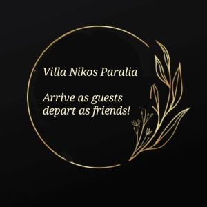 a gold circle with the words villa nissos papilla arrive as guests at Villa Nikos Paralia in Paralia Katerinis
