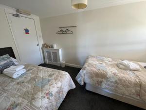 Postel nebo postele na pokoji v ubytování Anchor Hotel