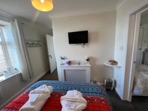 Postel nebo postele na pokoji v ubytování Anchor Hotel