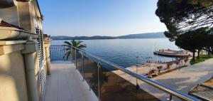 a balcony of a building with a view of a lake at Penthouse by the Sea in Tivat
