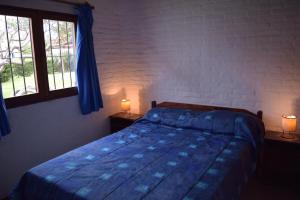 Säng eller sängar i ett rum på Bungalows Costa Esmeralda