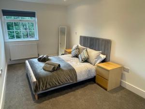 a bedroom with a bed and a window at Stunning New Townhouse in the Heart of Warwick in Warwick