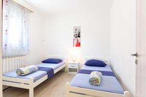 Posteľ alebo postele v izbe v ubytovaní Apartments MiraSol
