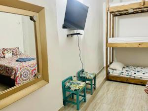 Postel nebo postele na pokoji v ubytování Hostal Badillo SV