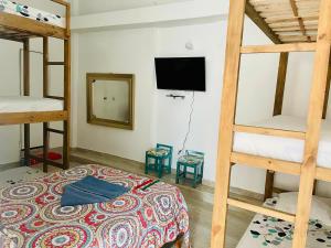 Postel nebo postele na pokoji v ubytování Hostal Badillo SV