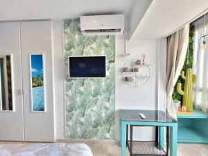 TV a/nebo společenská místnost v ubytování Sexi-Beach