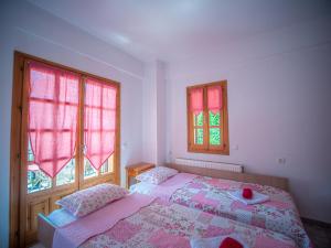 A bed or beds in a room at Cherry House in Damouchari with a sea view - Delicious Houses