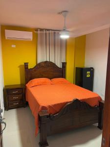 Postel nebo postele na pokoji v ubytování Hotel Gazcue