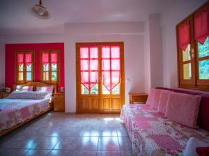 A bed or beds in a room at Cherry House in Damouchari with a sea view - Delicious Houses