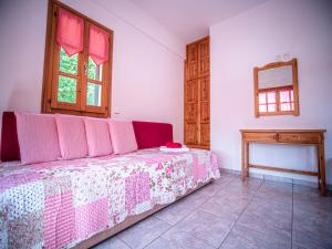 A bed or beds in a room at Cherry House in Damouchari with a sea view - Delicious Houses