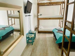 Postel nebo postele na pokoji v ubytování Hostal Badillo SV
