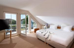 Precise Resort Rügen Apartments & SPLASH Erlebniswelt客房内的一张或多张床位