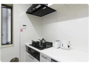 A kitchen or kitchenette at Hotel chen's house - Vacation STAY 42508v