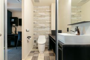 a bathroom with a white toilet and a sink at HOTEL TABARD TOKYO - Vacation STAY 64544v in Tokyo