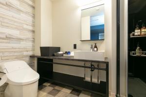 a bathroom with a white toilet and a sink at HOTEL TABARD TOKYO - Vacation STAY 64558v in Tokyo