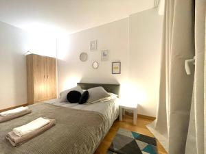 Posteľ alebo postele v izbe v ubytovaní Superbe appartement en centre-ville, 20min de Paris, 5 min d'Enghien