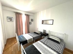 Posteľ alebo postele v izbe v ubytovaní Superbe appartement en centre-ville, 20min de Paris, 5 min d'Enghien
