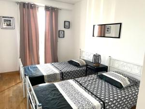 Posteľ alebo postele v izbe v ubytovaní Superbe appartement en centre-ville, 20min de Paris, 5 min d'Enghien
