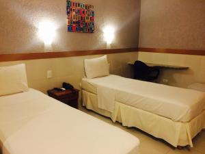 Cama ou camas em um quarto em Inter Hotel