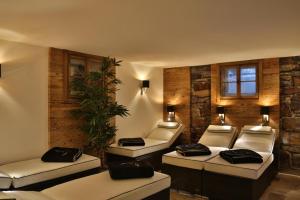 a room with four beds in a room at Eisbauer in Sankt Johann im Pongau