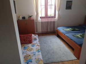 Postel nebo postele na pokoji v ubytování Pension Orbis