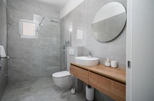 a bathroom with a sink and a mirror at Perla Luxury Apartment in Vodice +47 photos