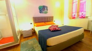 a bedroom with a bed and two windows at Finca del Sol in Lucca