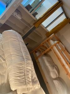 Posteľ alebo postele v izbe v ubytovaní Appartement en Rez de jardin