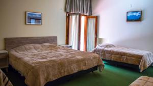 Ένα ή περισσότερα κρεβάτια σε δωμάτιο στο Casa Miranda
