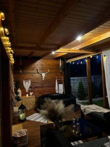 a living room with a chair and a table at my_brooklyn_ DOM Z OSB in Kielce
