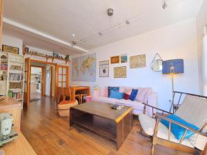 a living room with a couch and a table at Atico San Crispin in Cartagena