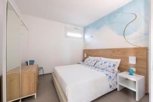 A bed or beds in a room at Venti di Laguna