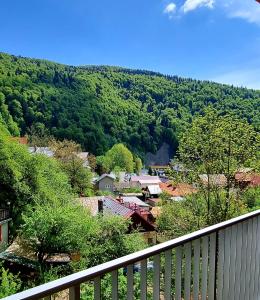 a view from a balcony of a town with trees at SARA Apart BelleView in Sinaia