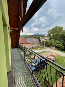 a balcony with a view of a yard at Domček u Mirka in Dolný Kubín