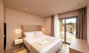 A bed or beds in a room at Sissi Lux Villas