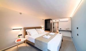 A bed or beds in a room at Sissi Lux Villas