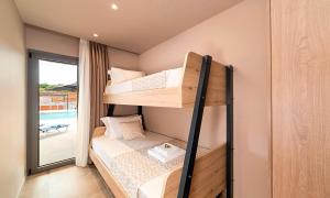A bed or beds in a room at Sissi Lux Villas