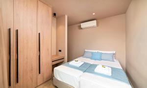 A bed or beds in a room at Sissi Lux Villas