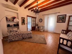 a living room with a couch and a table at Cal Tio Lluc in Sóller +34 photos