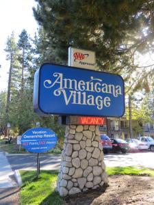 a sign for an american village on a street at Americana Village in South Lake Tahoe