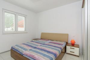 Postel nebo postele na pokoji v ubytování Villa Kiara apartma