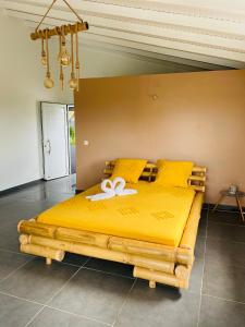 Postel nebo postele na pokoji v ubytování K'Noly + 6 fotografií