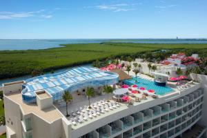 an aerial view of the resort with a swimming pool at Breathless Cancun Soul Resort & Spa - Adults Only - All Inclusive in Cancún