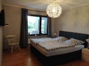 En eller flere senger på et rom på Ferienwohnung Landoase